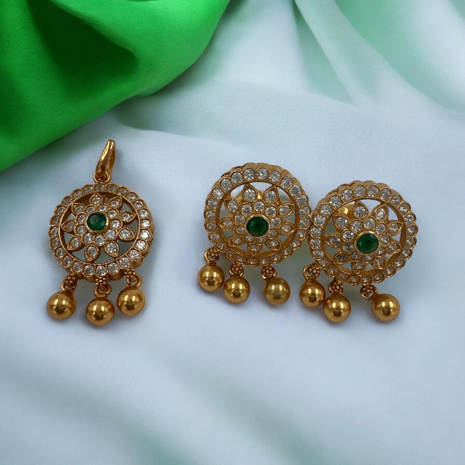 Cz stones  and green stone with gold polish pendent set