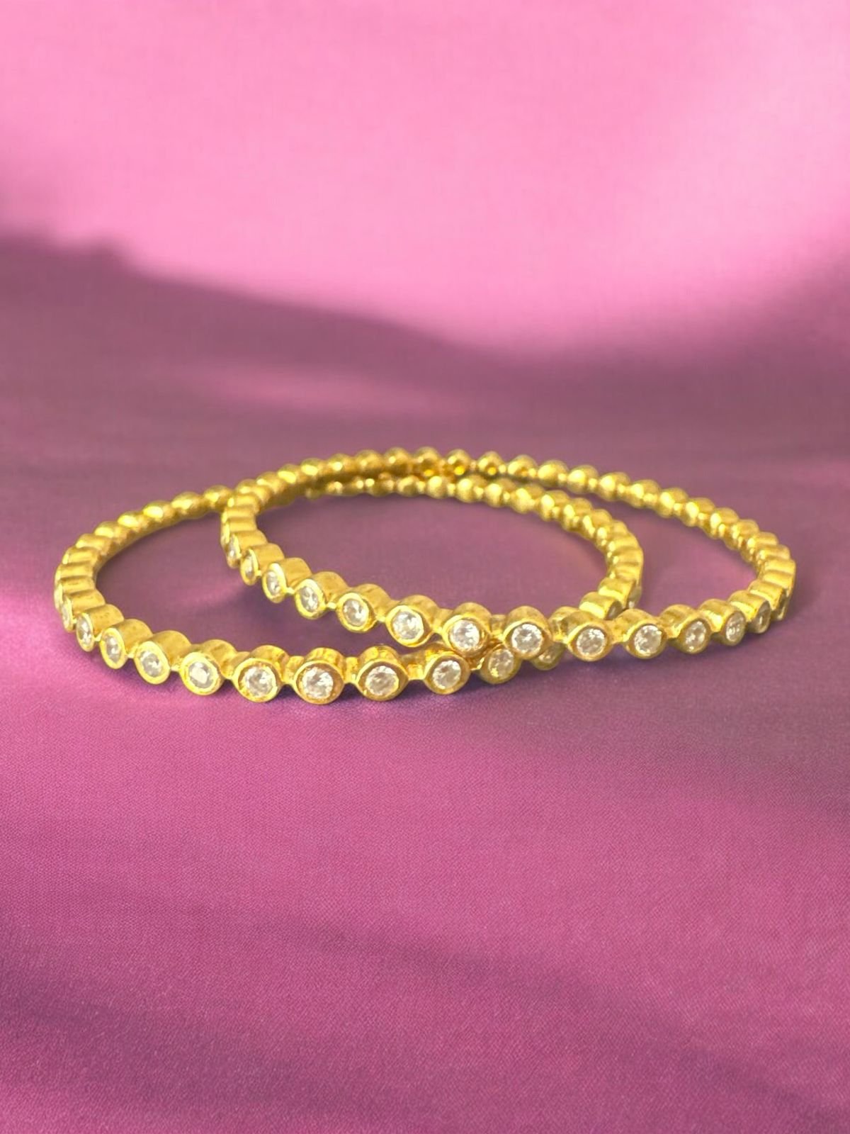 Cz stones bangles with gold polish