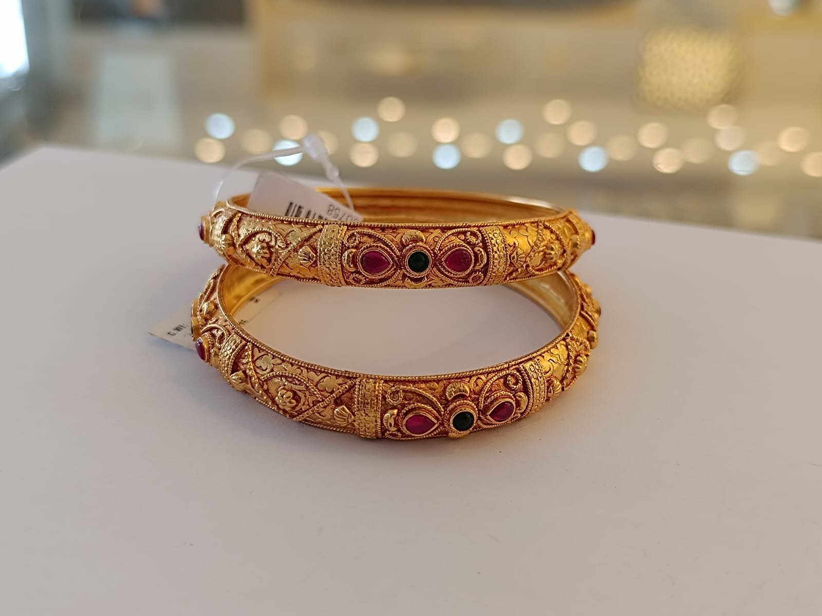 Gold polish & red and green stones bangle