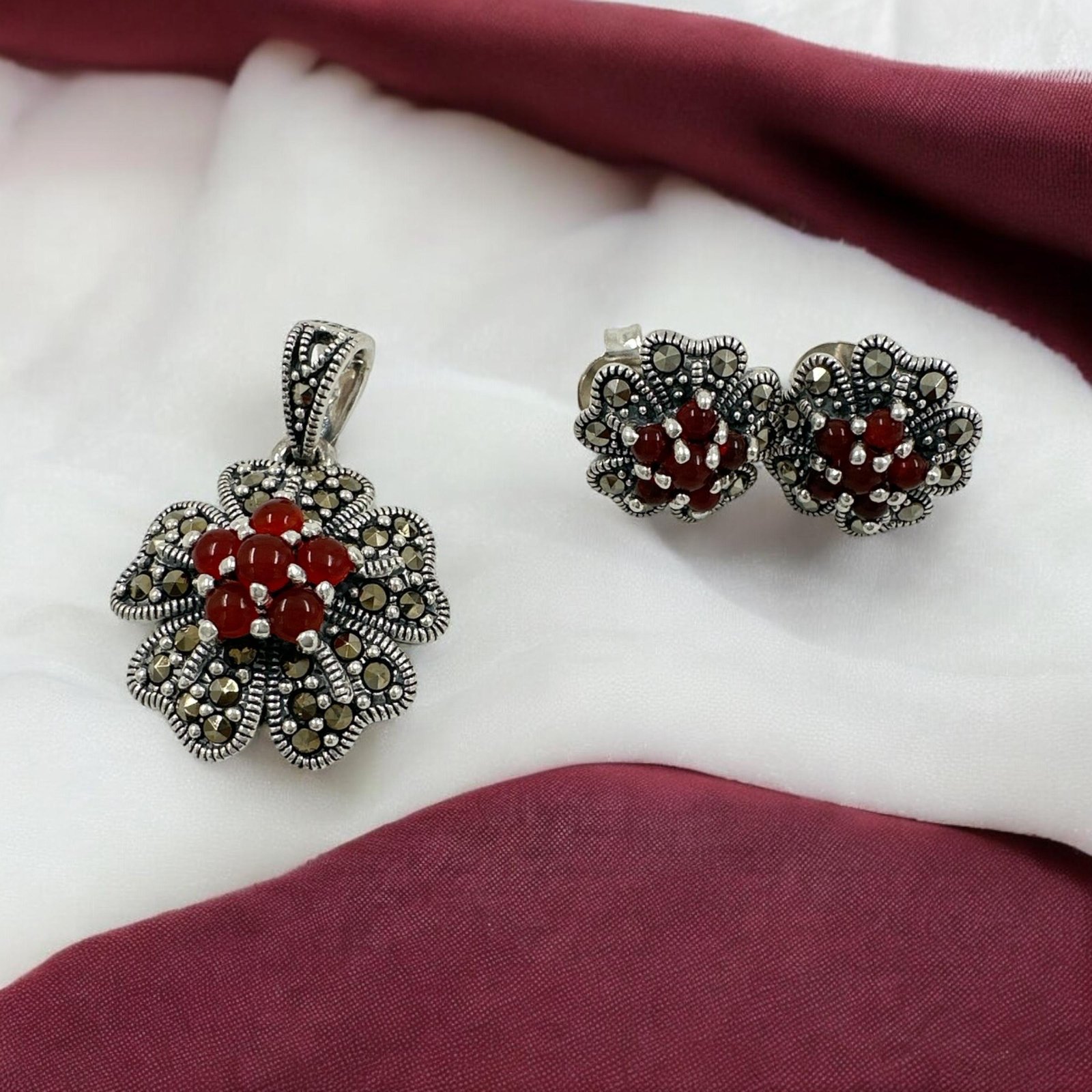 Marker stones and red stones with silver polish pendent set