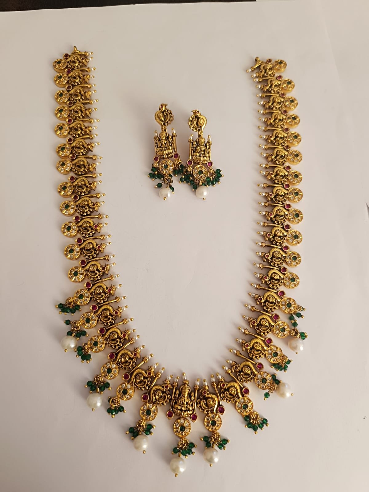 Peacock design and  cz white stones and  red and green stones  with antique polish with Ear rings