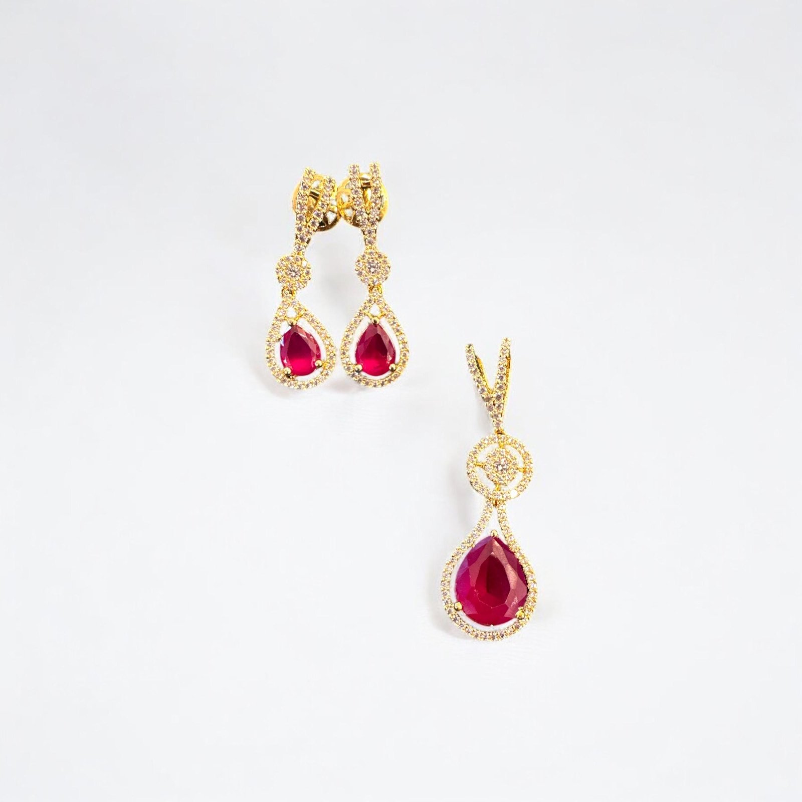 Premium cz stones with gold polish and red stone pendent set