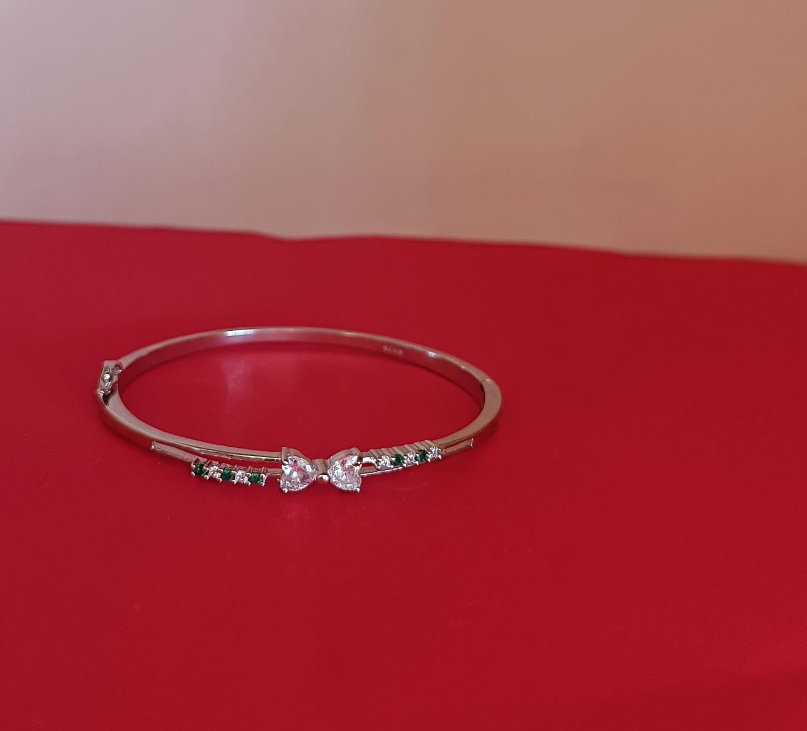 Premium cz stones with silver polish and green stones and white stones bracelet