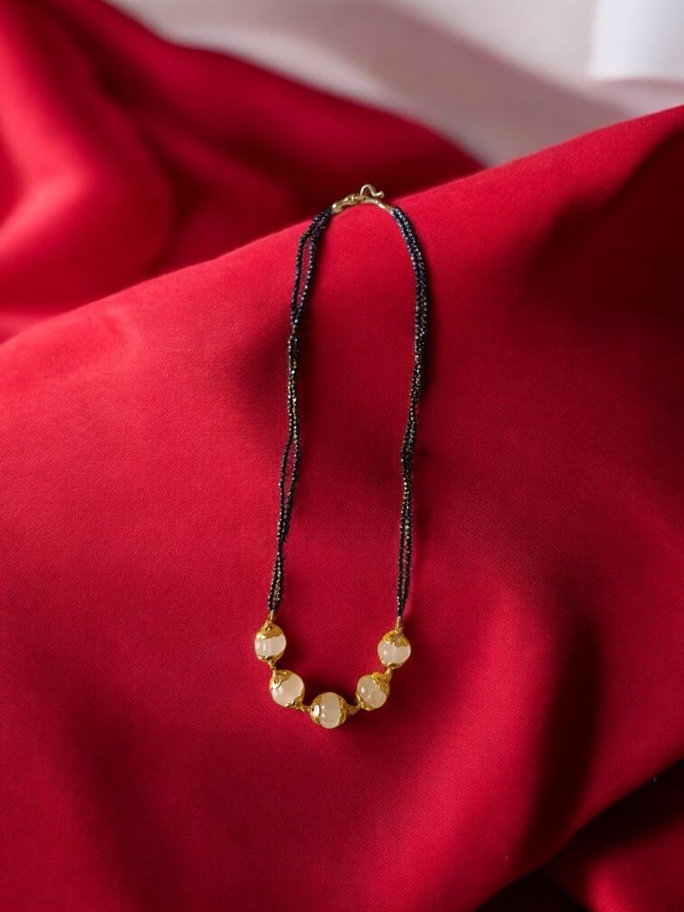 Pumpkin beads  lite  pink  colour and  black beads 2 lines