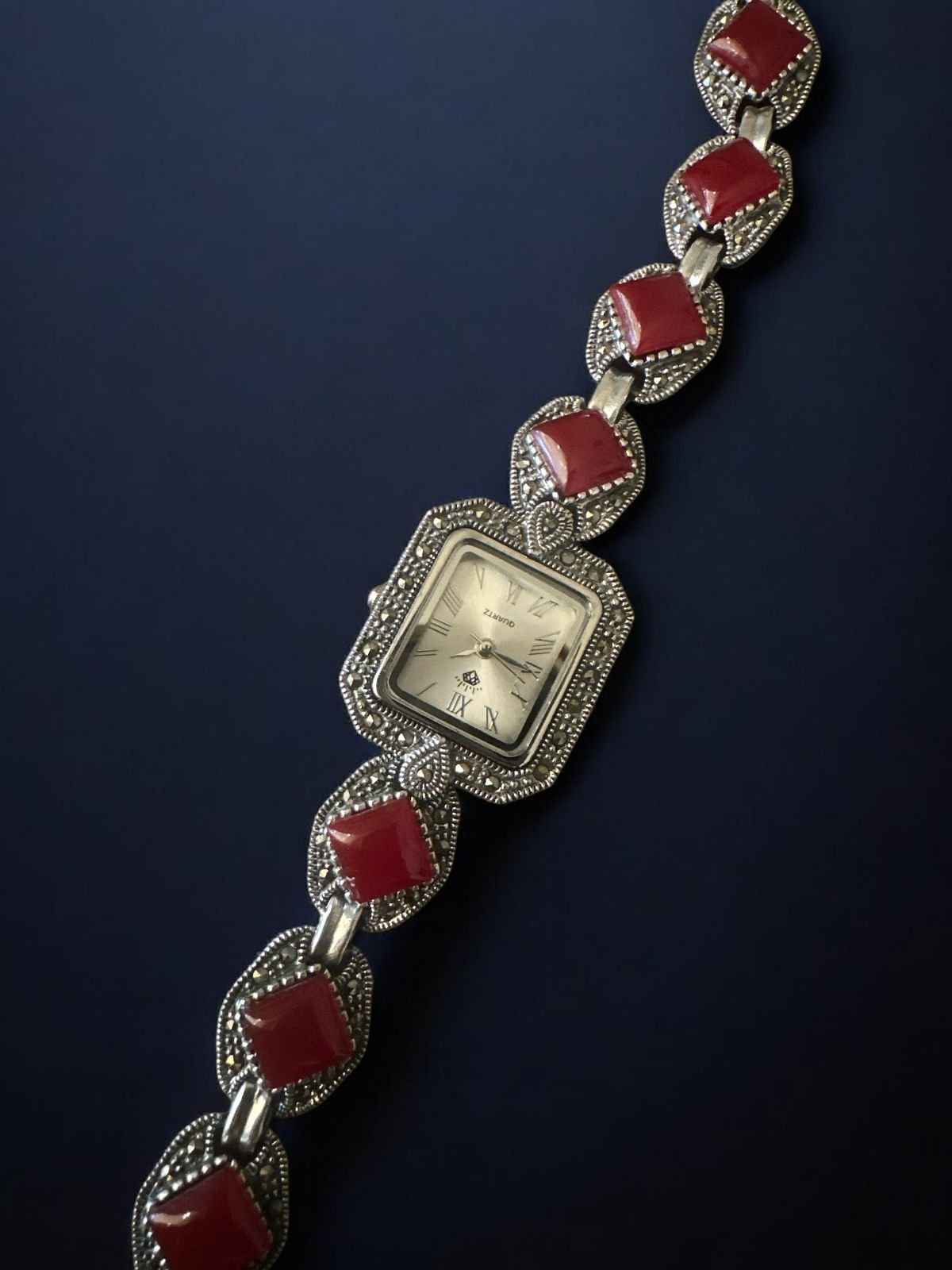 Ruby with marker stone’s studded watch